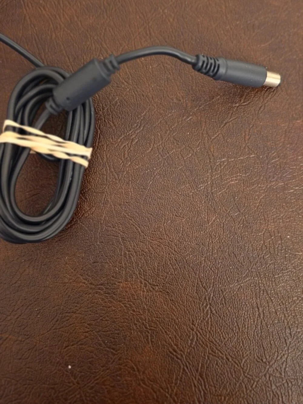 The Dell 90W Laptop Adapter Power Supply Charger -